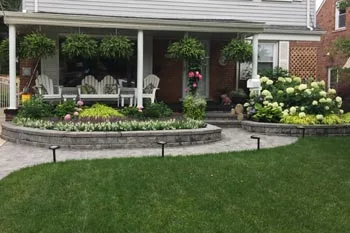 Landscaping in front of a residential home in Bloomfield that has recently been trimmed and pruned.